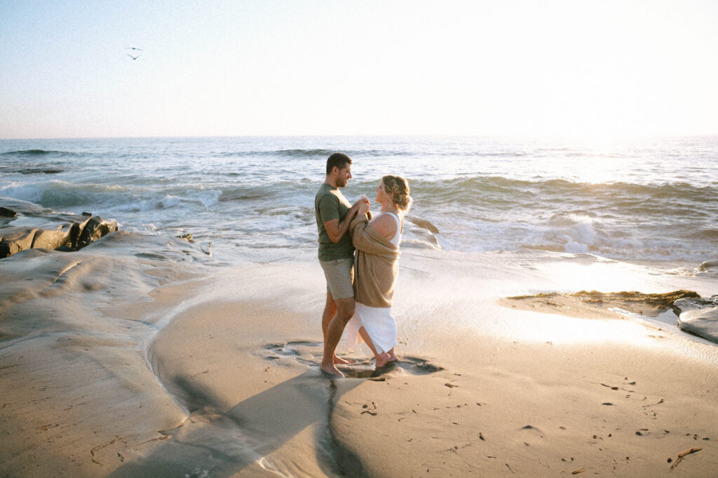 Beach engagement photo taken in La Jolla, romantic style offered in Seattle sessions