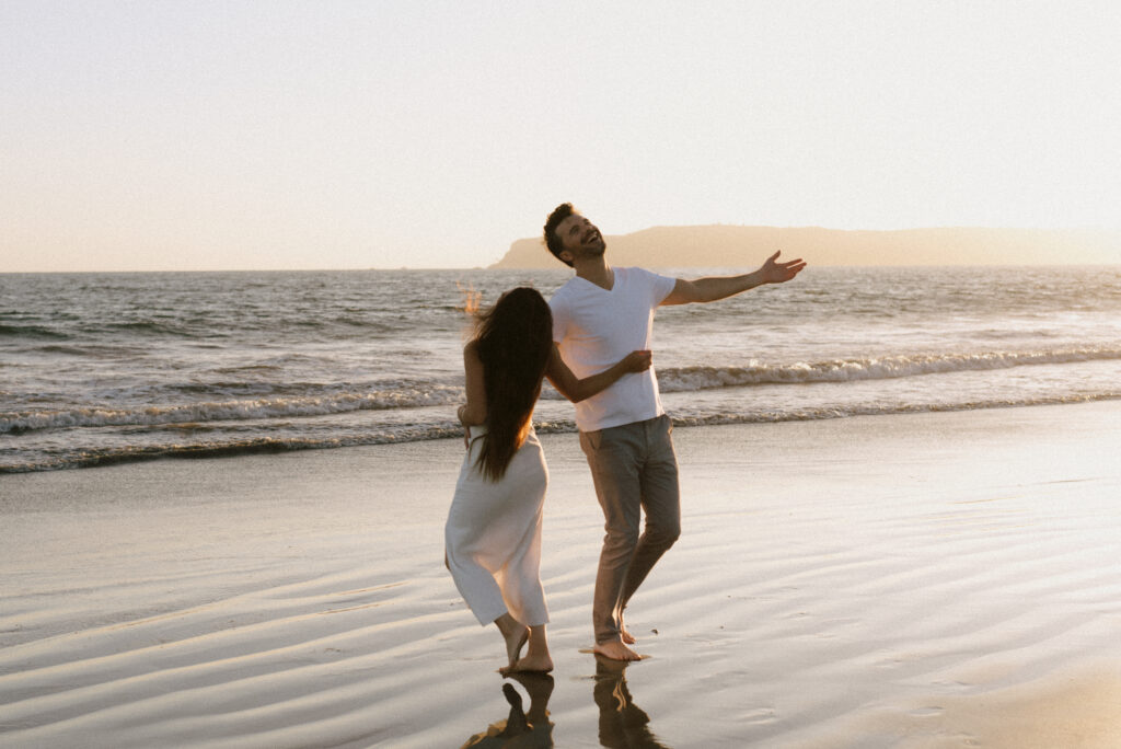 Seattle engagement photographer, golden hour beach engagement session, romantic couple portraits on the Washington coast, candid moments by the ocean, natural light engagement photography, Pacific Northwest love story