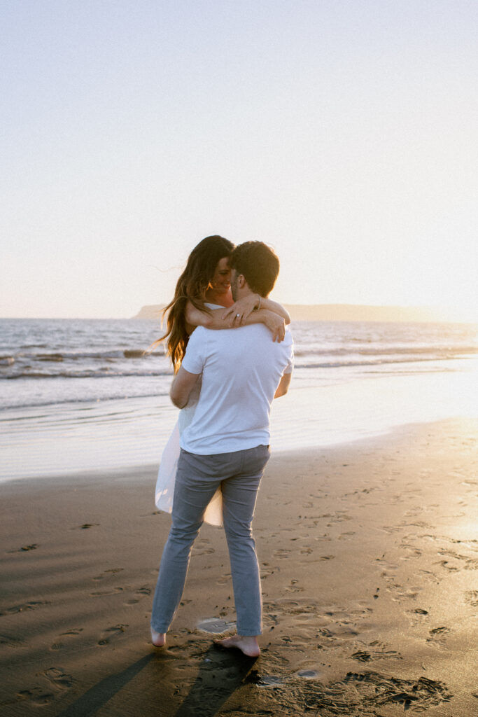 PNW beach engagement session, playful couple photos at sunset, outdoor engagement portraits Seattle, warm and emotional photography style, Seattle wedding and engagement photographer, documentary-style couples photography