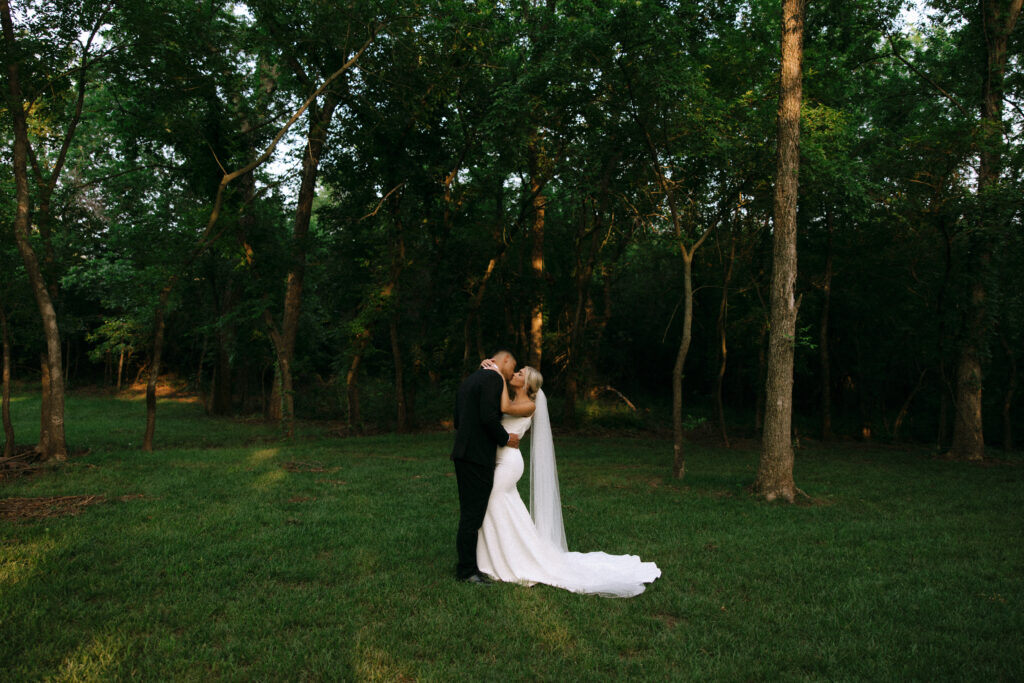 Bride and groom share a quiet moment in the forest at The Range wedding venue in Stillwater, Oklahoma, photo by Seattle wedding photographer Rachael Marie