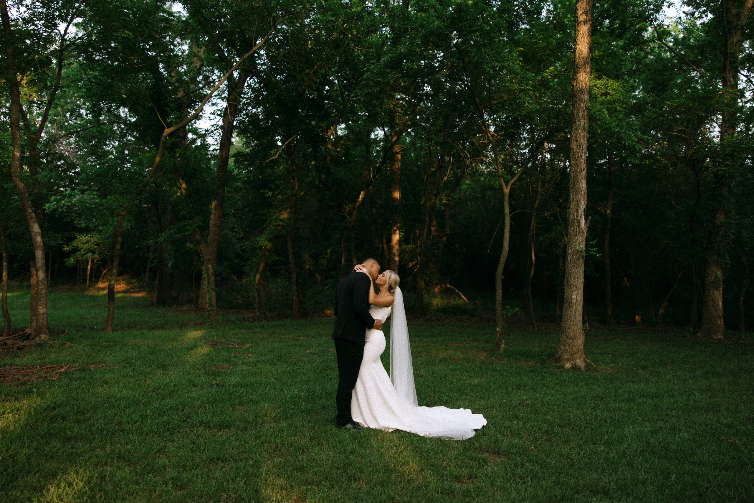 Bride and groom share a quiet moment in the woods at The Range wedding venue in Stillwater, Oklahoma – photo by Seattle wedding photographer Rachael Marie